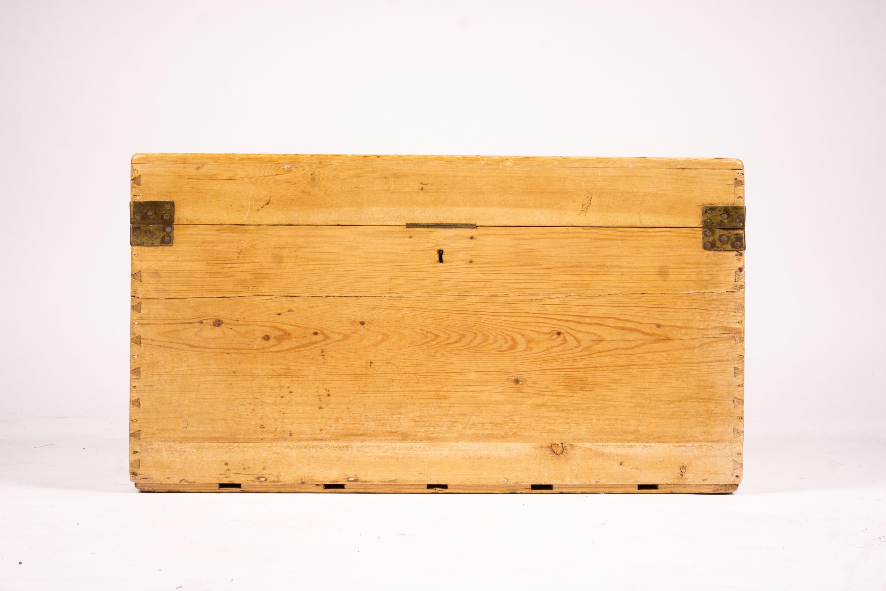 A small Victorian brass bound rectangular pine trunk, length 76cm, depth 46cm, height 42cm